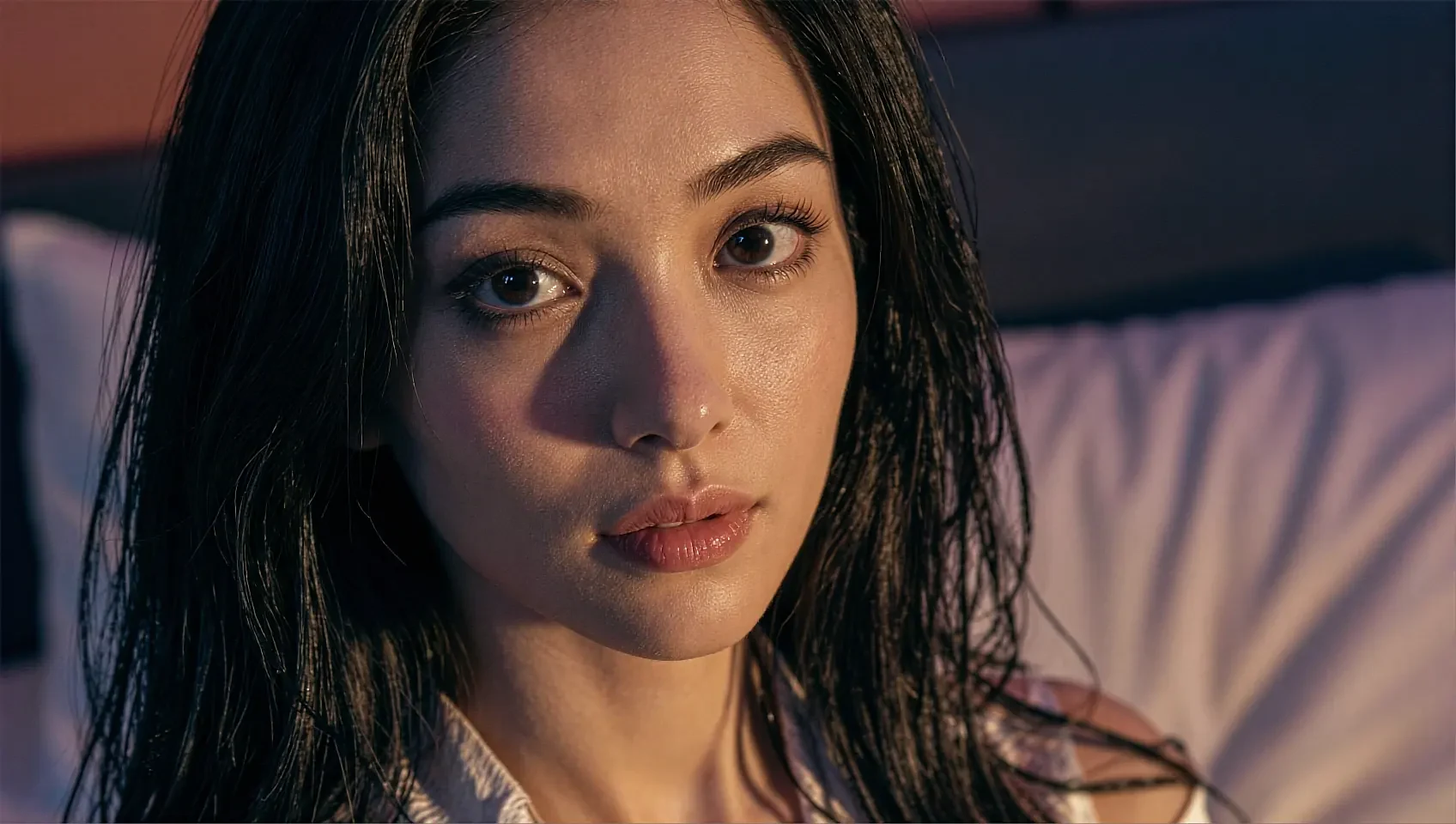 Close portrait of a fictional AI character looking straight down the lens